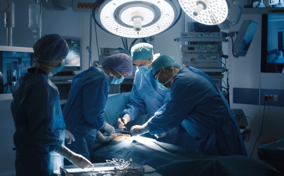 surgeons performing plastic surgery procedure